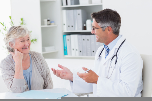 senior woman talking with doctor