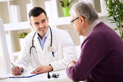 doctor and senior patient discussing medical history